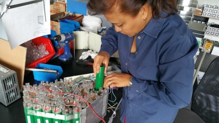 Jane changing cells on TW560's battery pack